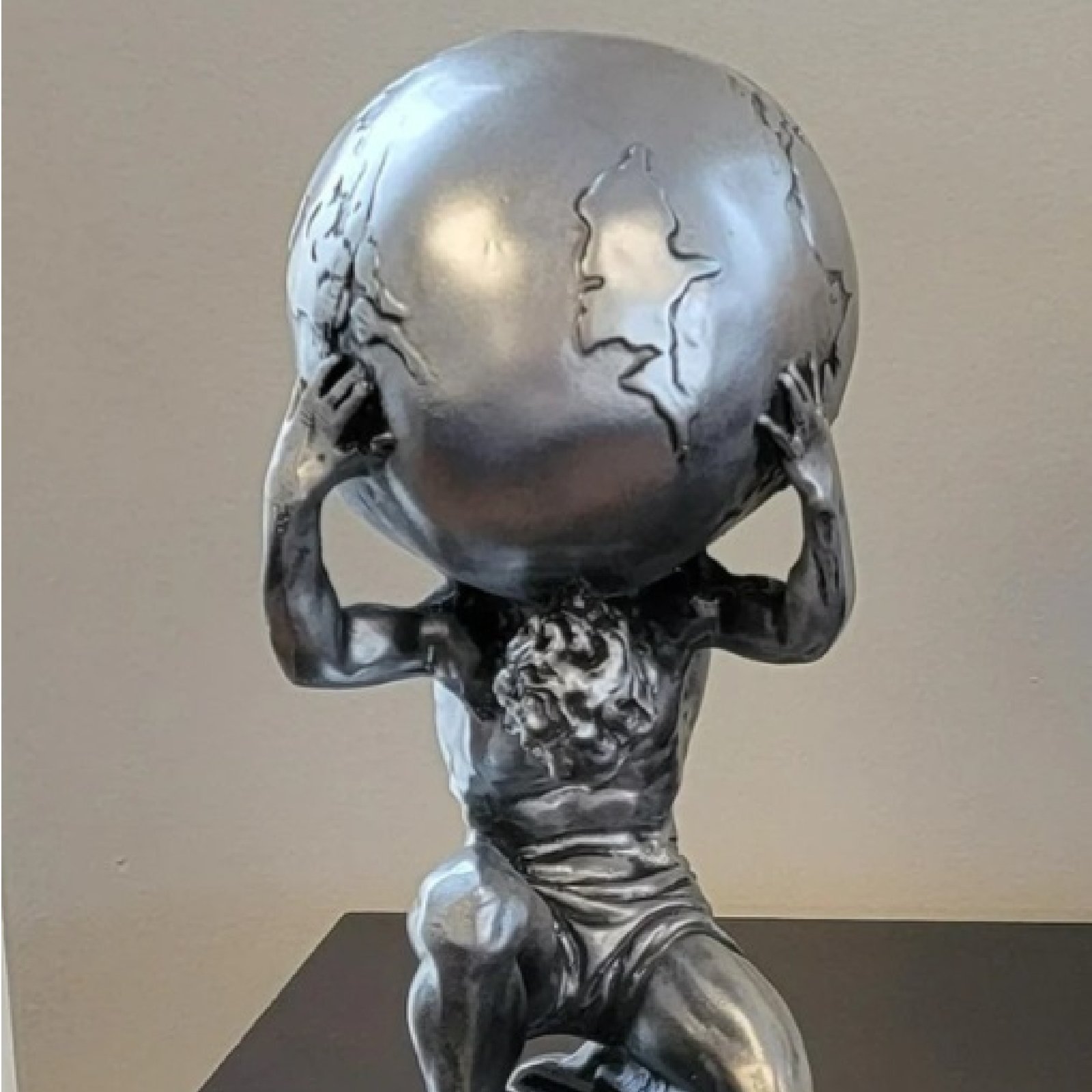 Atlas Figure Lifting Globe Sculpture